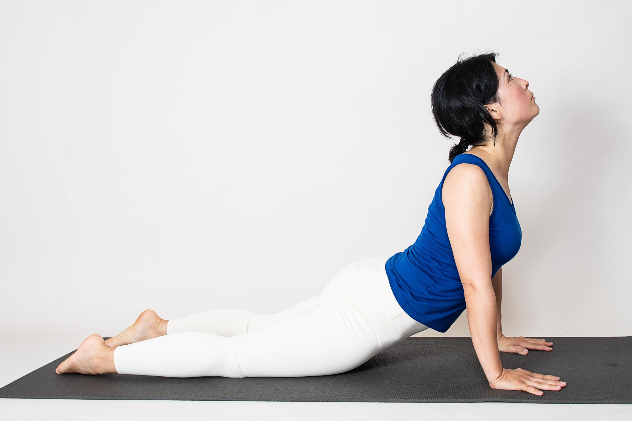 Woman practicing Bujangasana